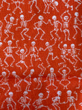 White Skeletons on Orange Cotton Fabric:  Sold by FQ