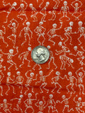 White Skeletons on Orange Cotton Fabric:  Sold by FQ