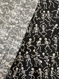 White Skeletons Dancing on Black Cotton Fabric:  Sold by FQ