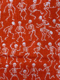 White Skeletons on Orange Cotton Fabric:  Sold by FQ