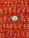 White Skeletons on Orange Cotton Fabric:  Sold by FQ