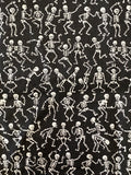 White Skeletons Dancing on Black Cotton Fabric:  Sold by FQ