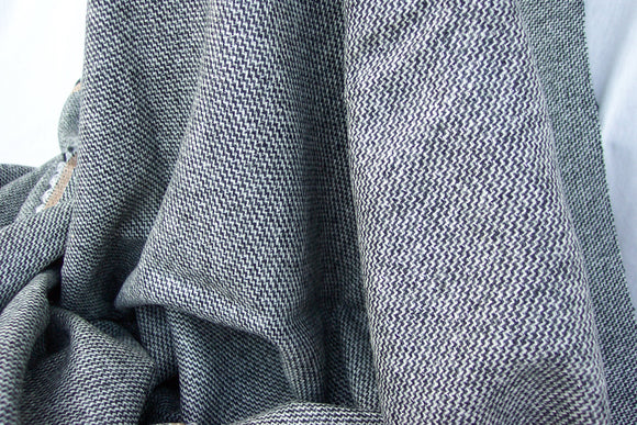 Black, White and Gray Tweed Fabric with a silver Metalic thread running through it.  60