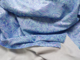Swirl Print Glitter Dance Wear Fabric, Poly/Lycra Marbled blues with lavender and white. 58/60" wide by 1.75 yards long